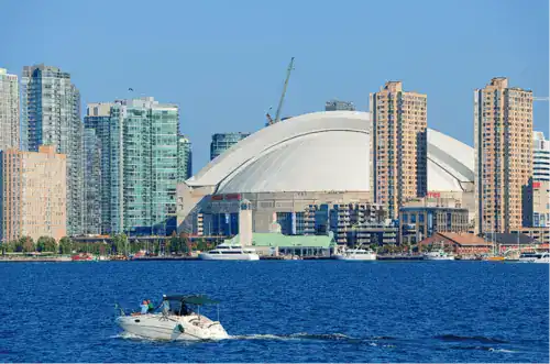 Ontario's Toronto waterfront skyline with dome stadium and yachts, representing In Good Nutrition's commitment to empowering Ontarians with personalized dietitian support.