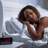 omen in her bed at night experiencing night sweats